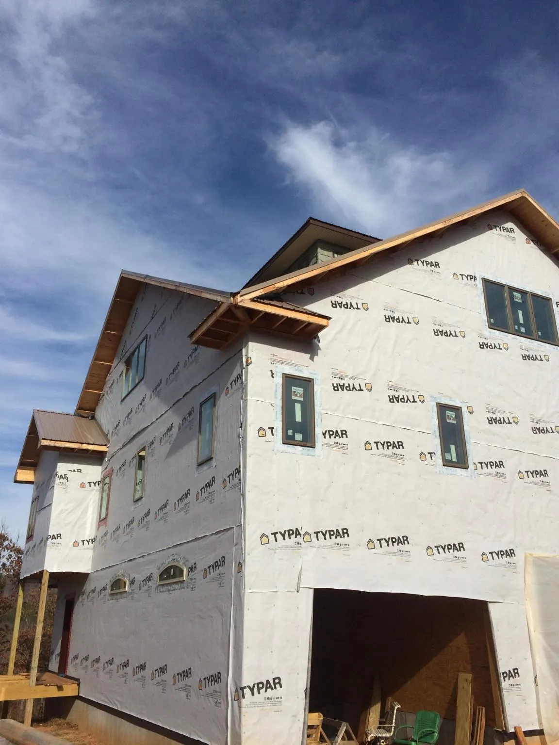 Stick built house wrapped in Typar with new roof framing and dormers in Lumberton